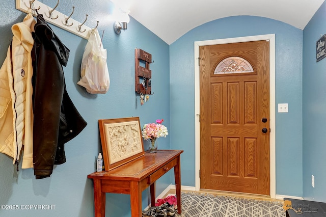 entrance foyer with vaulted ceiling