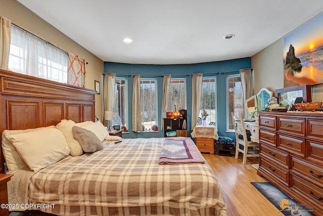 bedroom with light wood-type flooring