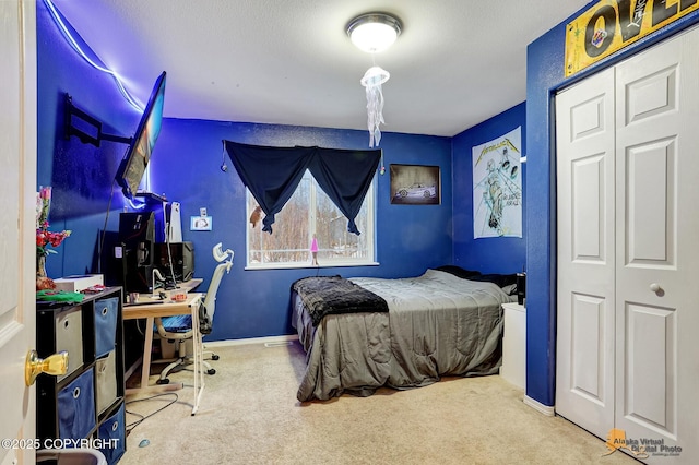 bedroom with carpet flooring and a closet