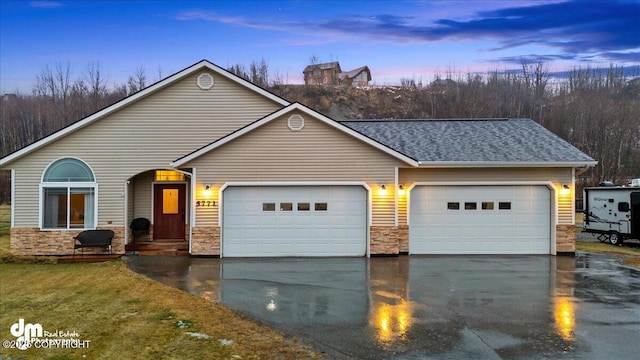 ranch-style house featuring a garage