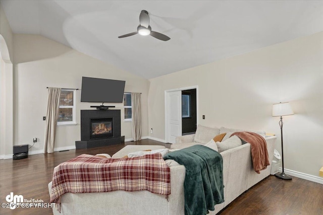 living room with ceiling fan, dark hardwood / wood-style floors, and lofted ceiling