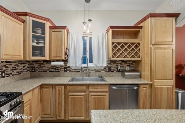 kitchen with light stone countertops, sink, pendant lighting, decorative backsplash, and appliances with stainless steel finishes