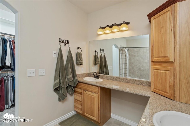 bathroom with vanity and curtained shower