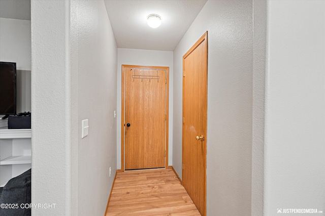 corridor featuring light hardwood / wood-style flooring