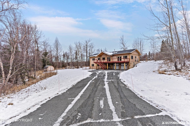 view of street featuring aphalt driveway