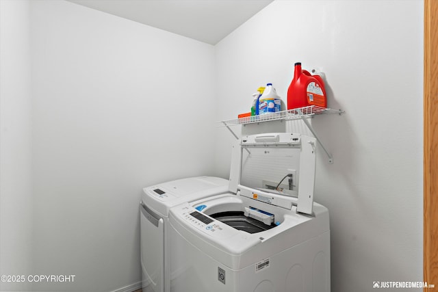 laundry area featuring laundry area and separate washer and dryer