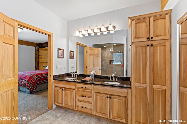 bathroom with a sink, ensuite bathroom, double vanity, and a shower stall