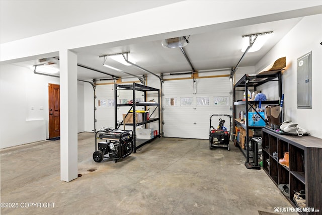 garage featuring electric panel and a garage door opener