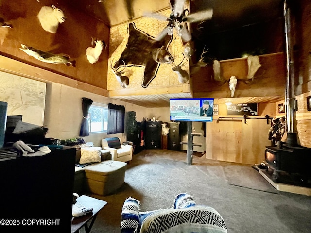 interior space featuring carpet flooring and a wood stove