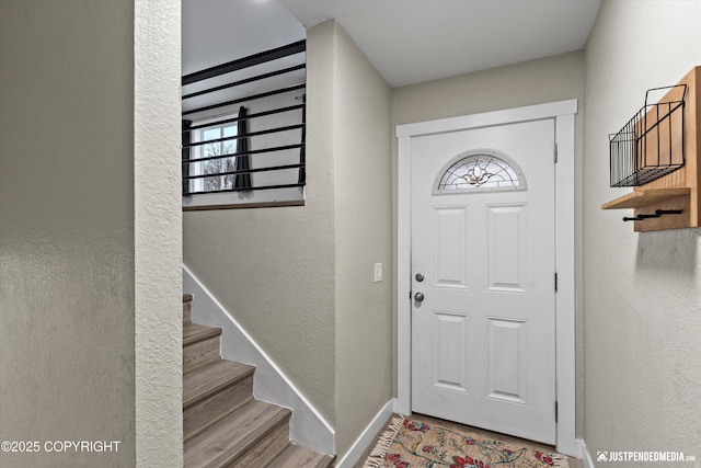 entryway with hardwood / wood-style floors