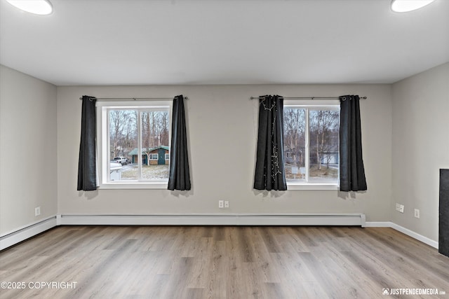 spare room featuring light wood-type flooring