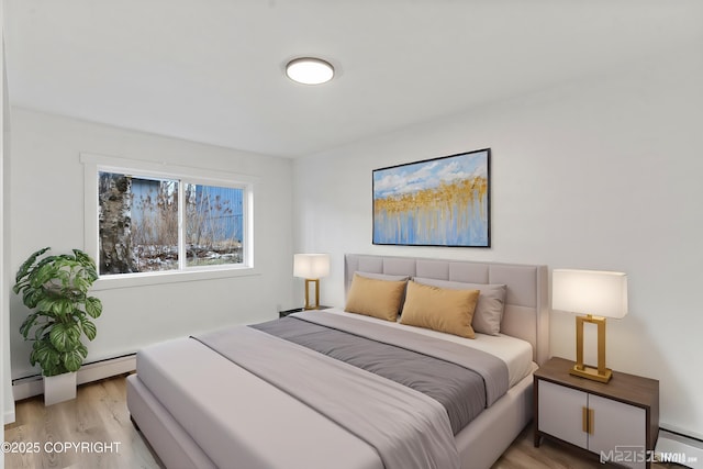 bedroom featuring a baseboard radiator and light hardwood / wood-style floors