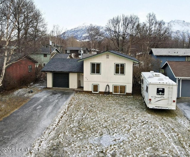 view of front of home featuring a garage and a mountain view