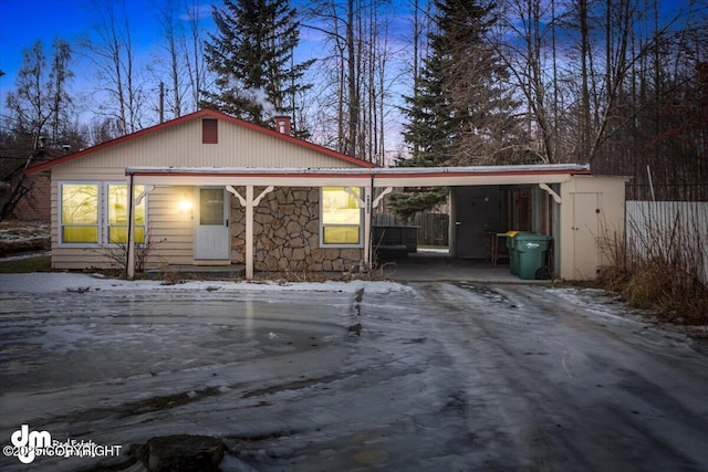 view of front of property with a carport