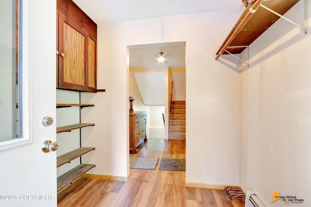 interior space featuring light hardwood / wood-style floors and baseboard heating