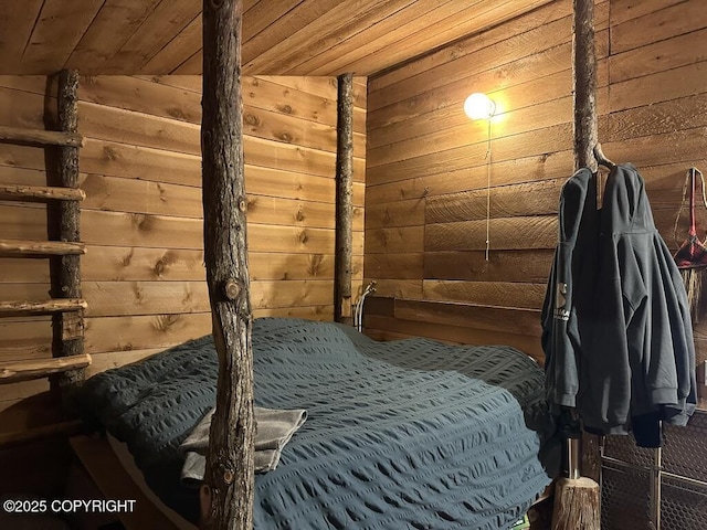 bedroom with vaulted ceiling, wooden ceiling, and wooden walls