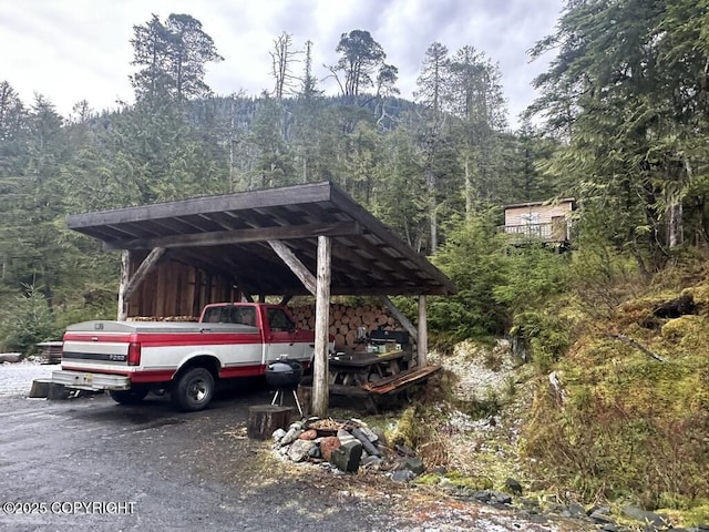 view of parking featuring a carport