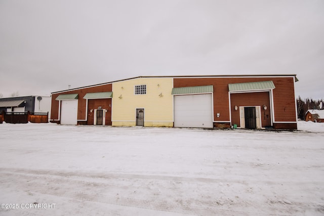 view of snow covered garage