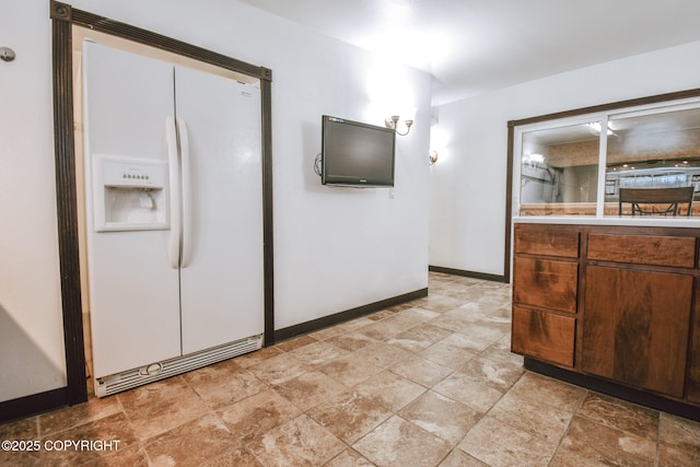 kitchen with white fridge with ice dispenser