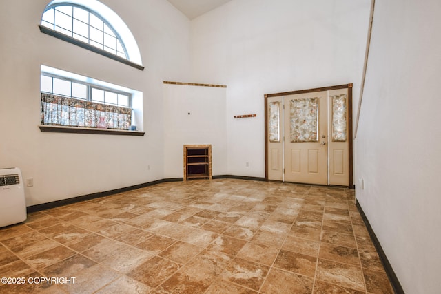 foyer featuring a high ceiling