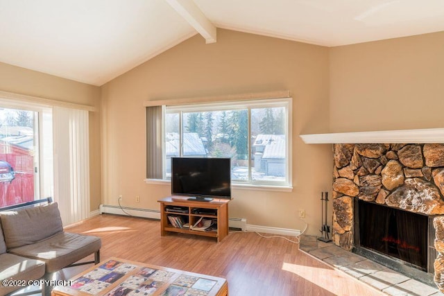 living room featuring baseboard heating, a stone fireplace, vaulted ceiling with beams, and hardwood / wood-style flooring