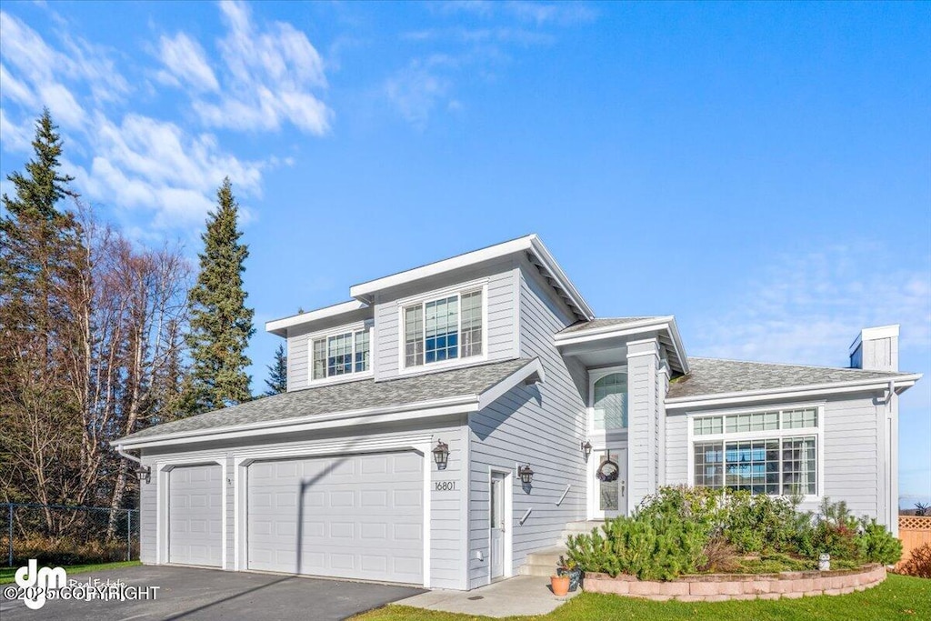 front of property with a garage