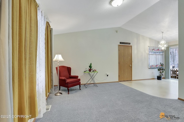 living area featuring lofted ceiling, carpet flooring, and a chandelier