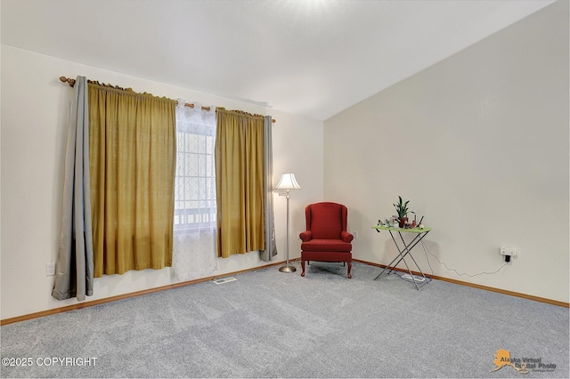 unfurnished room with lofted ceiling and carpet flooring