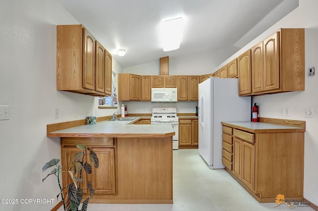 kitchen with white appliances, kitchen peninsula, sink, and lofted ceiling