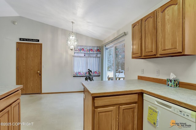 kitchen with a chandelier, hanging light fixtures, kitchen peninsula, white dishwasher, and lofted ceiling