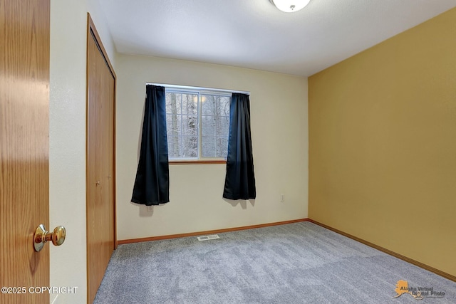 spare room with carpet floors