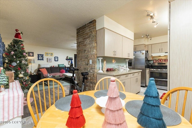 dining area with a textured ceiling