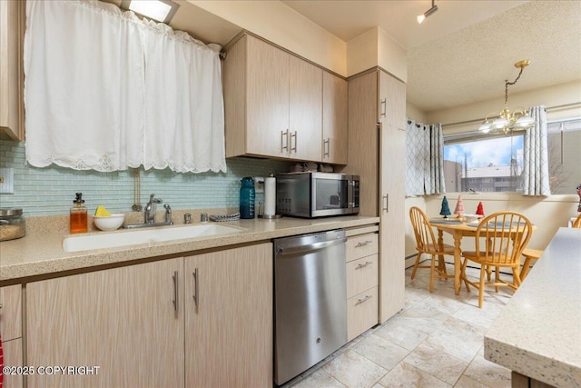 kitchen with pendant lighting, an inviting chandelier, light brown cabinetry, tasteful backsplash, and appliances with stainless steel finishes