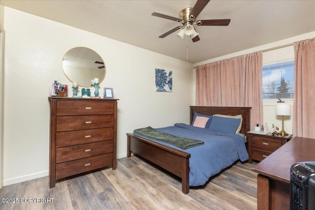 bedroom featuring hardwood / wood-style floors and ceiling fan