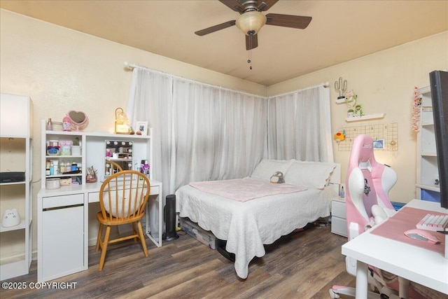 bedroom featuring ceiling fan and dark hardwood / wood-style flooring