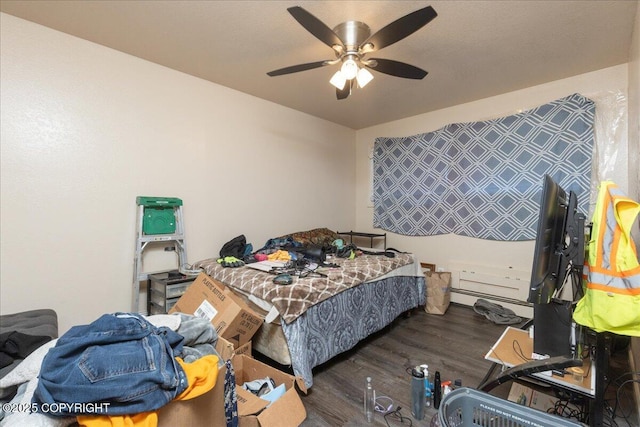 bedroom featuring dark hardwood / wood-style floors and ceiling fan