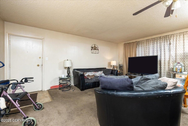 carpeted living room with ceiling fan and a textured ceiling