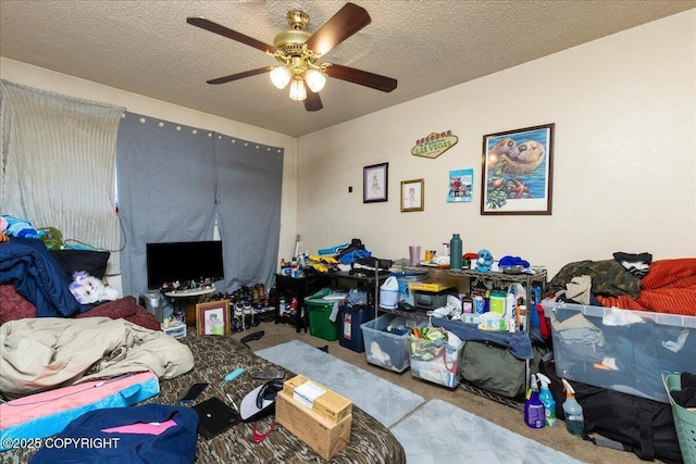 carpeted bedroom with ceiling fan and a textured ceiling