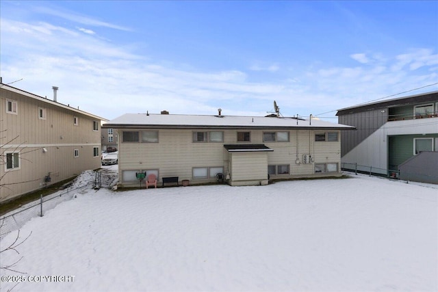 view of snow covered house