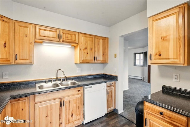 kitchen with dishwasher, a sink, baseboard heating, and dark countertops