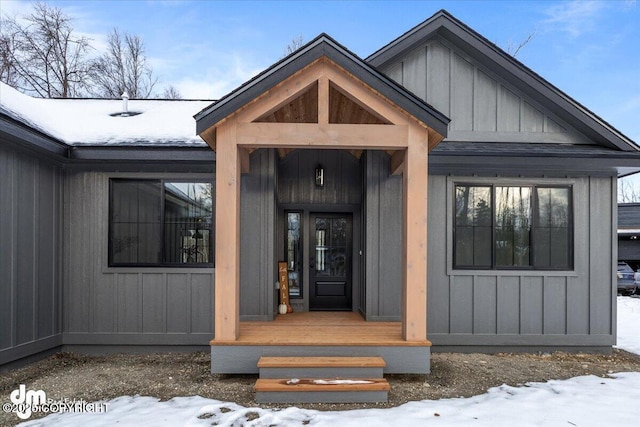 view of snow covered property entrance