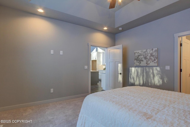 bedroom featuring carpet flooring, ceiling fan, and a high ceiling