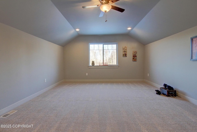 bonus room featuring light carpet, ceiling fan, and vaulted ceiling