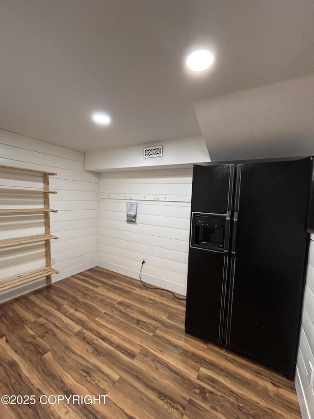 interior space with dark wood finished floors, visible vents, and recessed lighting