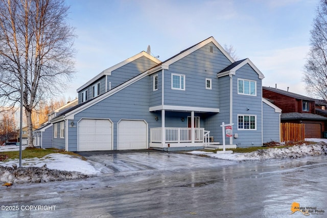 front of property with a garage and a porch