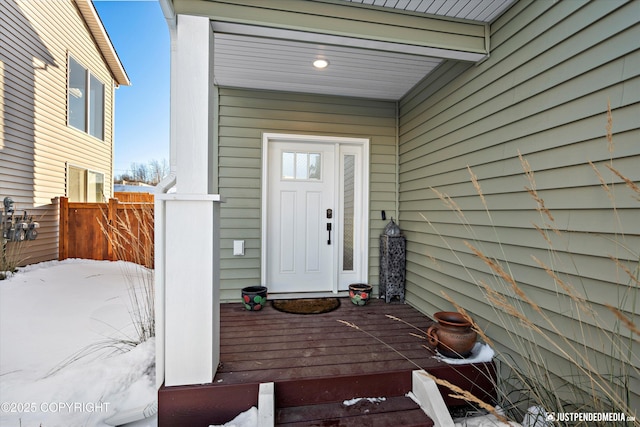 view of snow covered property entrance