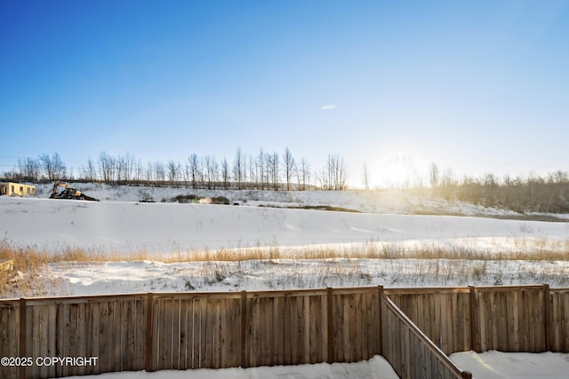 view of yard layered in snow