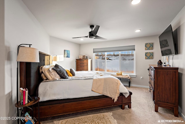 bedroom with ceiling fan and light colored carpet