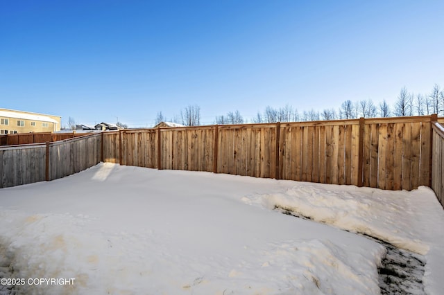 view of yard covered in snow