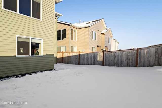 view of yard layered in snow